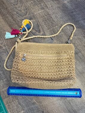 The Sak Tan Crochet Crossbody with Multicolor Tassel Charm